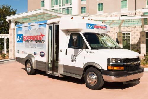 a white food truck parked in front of a building at Hampton Inn & Suites Tampa Airport Avion Park Westshore in Tampa