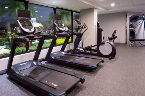 a gym with multiple phones on the wall at Home2 Suites By Hilton Tampa Downtown Channel District in Tampa