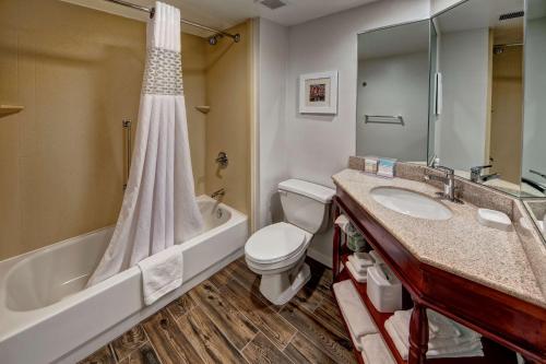 a bathroom with a tub and a toilet and a sink at Hampton Inn Concord/Kannapolis in Kannapolis