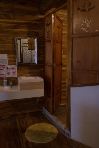 a bathroom with a sink and a mirror at Hotel Calamari Baru in Playa Blanca
