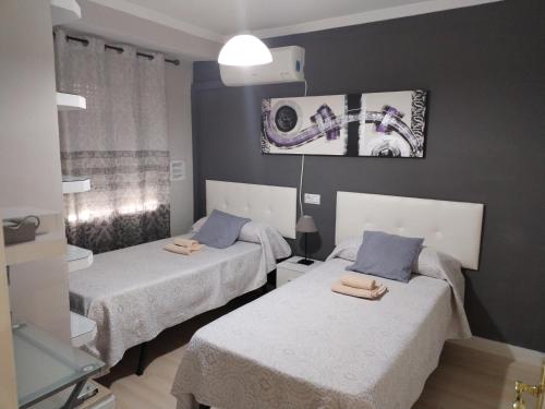 Posteľ alebo postele v izbe v ubytovaní Apartamento con parking privado gratis incluido