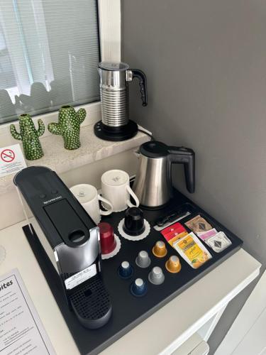 a coffee maker sitting on top of a counter at 18 Dante Luxury Suites in Cagliari