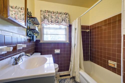 a bathroom with a sink and a tub and a toilet at Fayetteville Vacation Rental about 6 Mi to Downtown! in Fayetteville