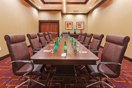 a conference room with a long table and chairs at Hilton Garden Inn Midland in Midland