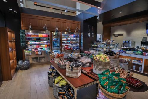 a store with baskets on a counter in a store at Hilton Miami Airport Blue Lagoon in Miami