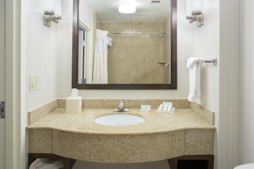 a bathroom with a sink and a shower at Hilton Garden Inn Phoenix/Avondale in Avondale