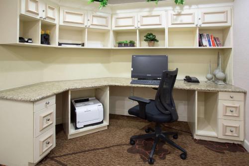 an office with a desk with a computer and a chair at Hilton Garden Inn Phoenix/Avondale in Avondale