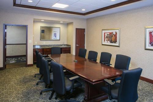 a conference room with a wooden table and chairs at Hampton Inn & Suites Toledo-Perrysburg in Rossford