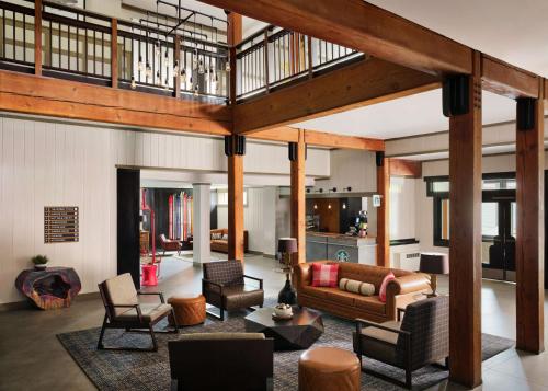 a large living room with a couch and chairs at Killington Mountain Lodge, Tapestry Collection by Hilton in Killington