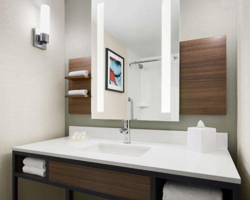 a bathroom with a sink and a mirror at Hilton Garden Inn Las Vegas/Henderson in Las Vegas