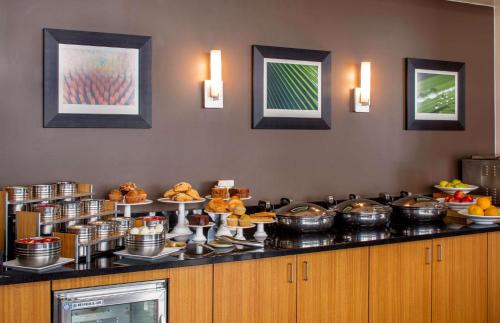 a buffet line with food on top at DoubleTree Suites by Hilton Minneapolis Downtown in Minneapolis