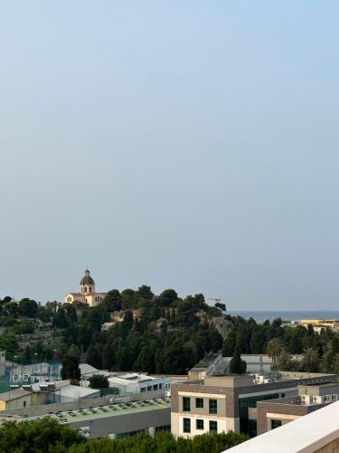 a view of a city with buildings and trees at 18 Dante Luxury Suites in Cagliari