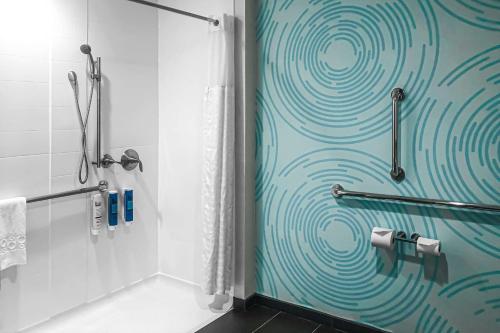 a bathroom with a shower with a glass door at Tru By Hilton Smyrna Nashville in Smyrna