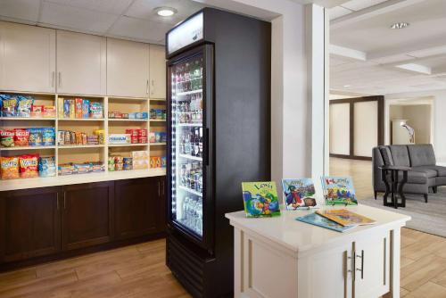 a store with a large refrigerator filled with food at Homewood Suites by Hilton Baltimore-Washington Intl Apt in Linthicum Heights