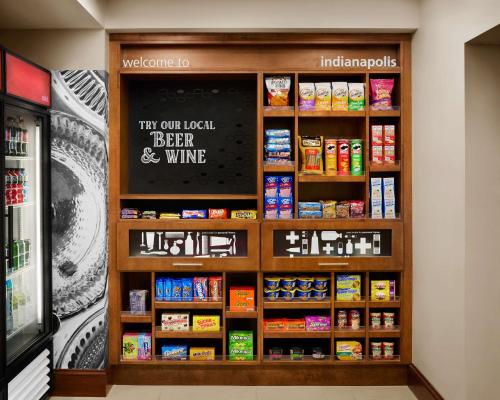 a food section of a grocery store with a shelf of food at Hampton Inn Indianapolis Northwest - Park 100 in Indianapolis