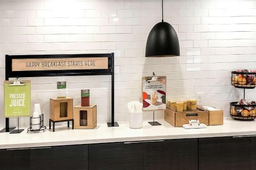 a counter with some boxes and a sign on it at Hampton Inn Philadelphia/King of Prussia - Valley Forge in King of Prussia