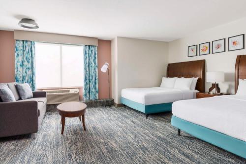 Letto o letti in una camera di Hilton Garden Inn Orlando at SeaWorld