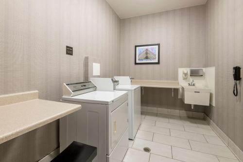 a small bathroom with a sink and a stove at Homewood Suites by Hilton Mount Laurel in Mount Laurel