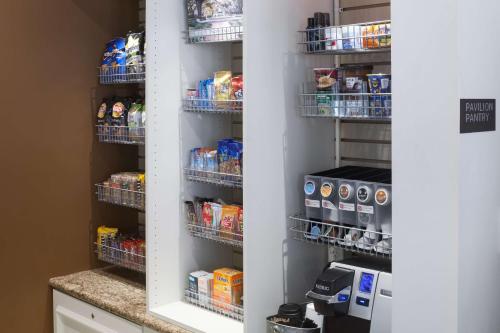 a walk in pantry with food and drinks at Hilton Garden Inn Savannah Airport in Savannah