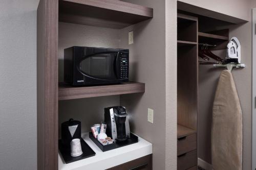 a microwave sitting on a shelf in a bathroom at Hilton Garden Inn Savannah Airport in Savannah