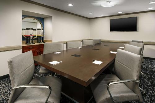 a conference room with a large wooden table and chairs at Hampton Inn & Suites Baltimore Inner Harbor in Baltimore