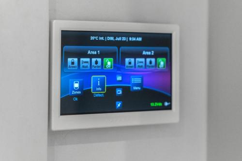 an image of an electronic screen on a wall at Le Sainte-Marie - Vieux-Terrebonne in Terrebonne