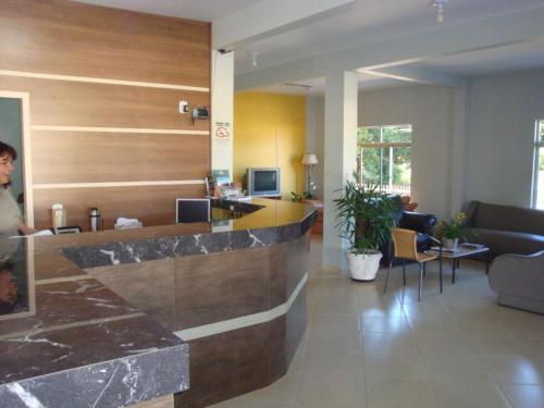 a lobby of a hospital with a reception counter at GB Hotéis Foz in Foz do Iguaçu