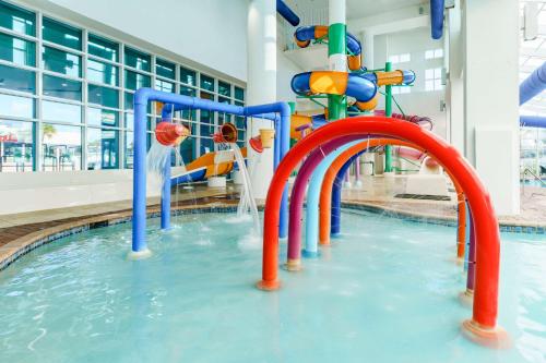 a water slide in a swimming pool at Homewood Suites by Hilton Myrtle Beach Oceanfront in Myrtle Beach