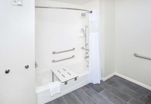 a bathroom with a shower and a sink at Hampton Inn & Suites LAX El Segundo in El Segundo