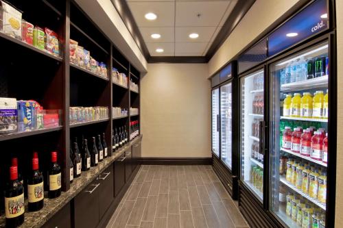 a store aisle with bottles of wine at Hampton Inn & Suites Bellevue Downtown/Seattle in Bellevue