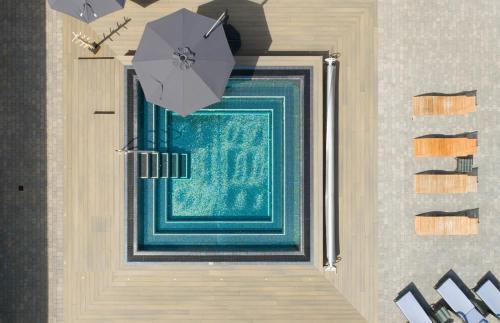 a door with a green rug and an umbrella at Barton Hall Hotel & Spa in Kettering
