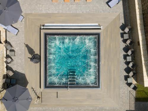 an overhead view of a pool with a ladder in the water at Barton Hall Hotel & Spa in Kettering