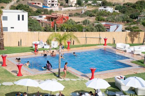 a group of people in a swimming pool at CASA DEL TITO in Oulad Akkou