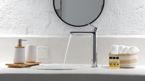 a bathroom counter with a mirror and a sink at White Haven Cave Home in Mesaria