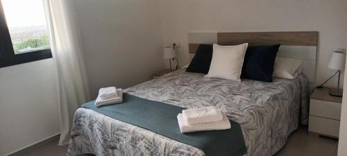 Katil atau katil-katil dalam bilik di Apartamentos Falcón