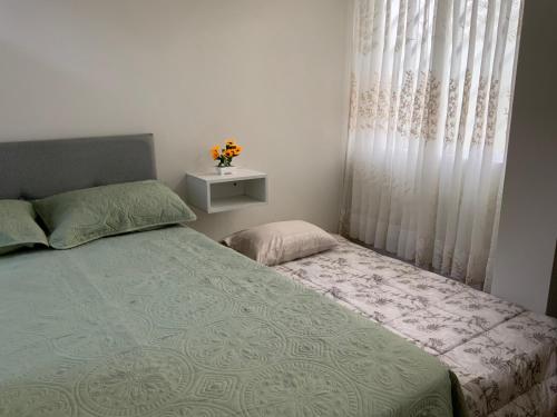 a bedroom with a bed and a window at MODERN HOUSE full apartment-planta baja in Lima