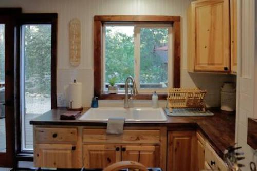 a kitchen with a sink and a window at Hobbit House - Charming In Town in Idyllwild