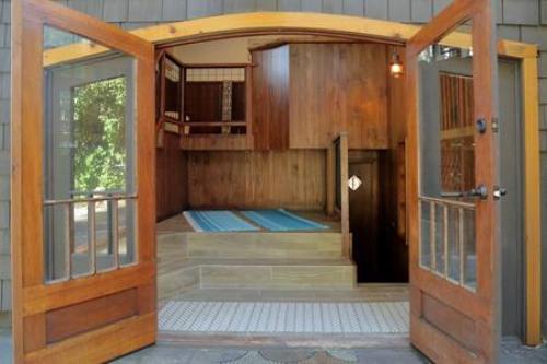 an open door to a room with a balcony at Hobbit House - Charming In Town in Idyllwild