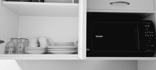 Kuchyň nebo kuchyňský kout v ubytování Quarto Familia