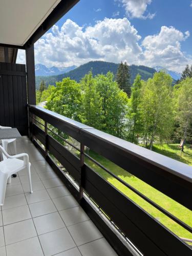 a balcony with a view of the mountains at Appartementhaus Birkenwald in Seefeld in Tirol