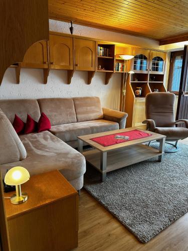 a living room with a couch and a coffee table at Appartementhaus Birkenwald in Seefeld in Tirol