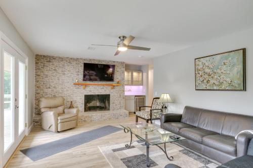 a living room with a couch and a fireplace at Waterfront Lakehouse with Private Dock and Fire Pit! in Chapin