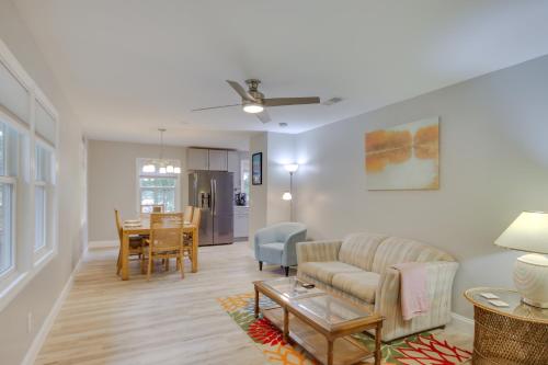 a living room with a couch and a table at Waterfront Lakehouse with Private Dock and Fire Pit! in Chapin
