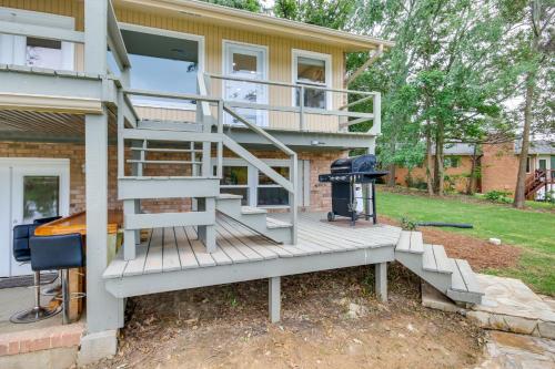 a staircase leading up to a house with a grill at Waterfront Lakehouse with Private Dock and Fire Pit! in Chapin