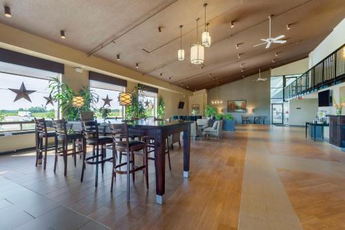 a large dining room with a table and chairs at Best Western Pembroke Inn & Conference Centre in Pembroke