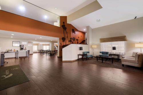 a large living room with a couch and a table at Sleep Inn Kernersville I-40 in Kernersville