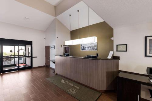 a large kitchen with a counter in a room at Sleep Inn Kernersville I-40 in Kernersville