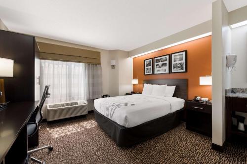 a hotel room with a bed and a window at Sleep Inn Kernersville I-40 in Kernersville