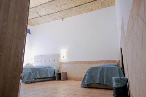 a hospital room with two beds and a window at Hotel Alex Square in Rome