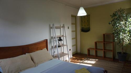 Ένα ή περισσότερα κρεβάτια σε δωμάτιο στο Ventana Sur Hostal